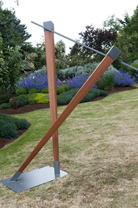 Icarus - life size, african mahogany and steel
